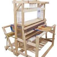photo showing a colinial v2 45" weaving width 12 shaft floor loom