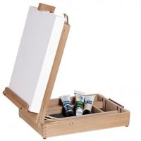 a wooden table top box easel with storage for painting and brushes