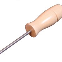 a sharp metal awl with a laquered wooden handle by ashford for drum carders