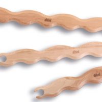 Three wooden stick shuttles with wavy edges
